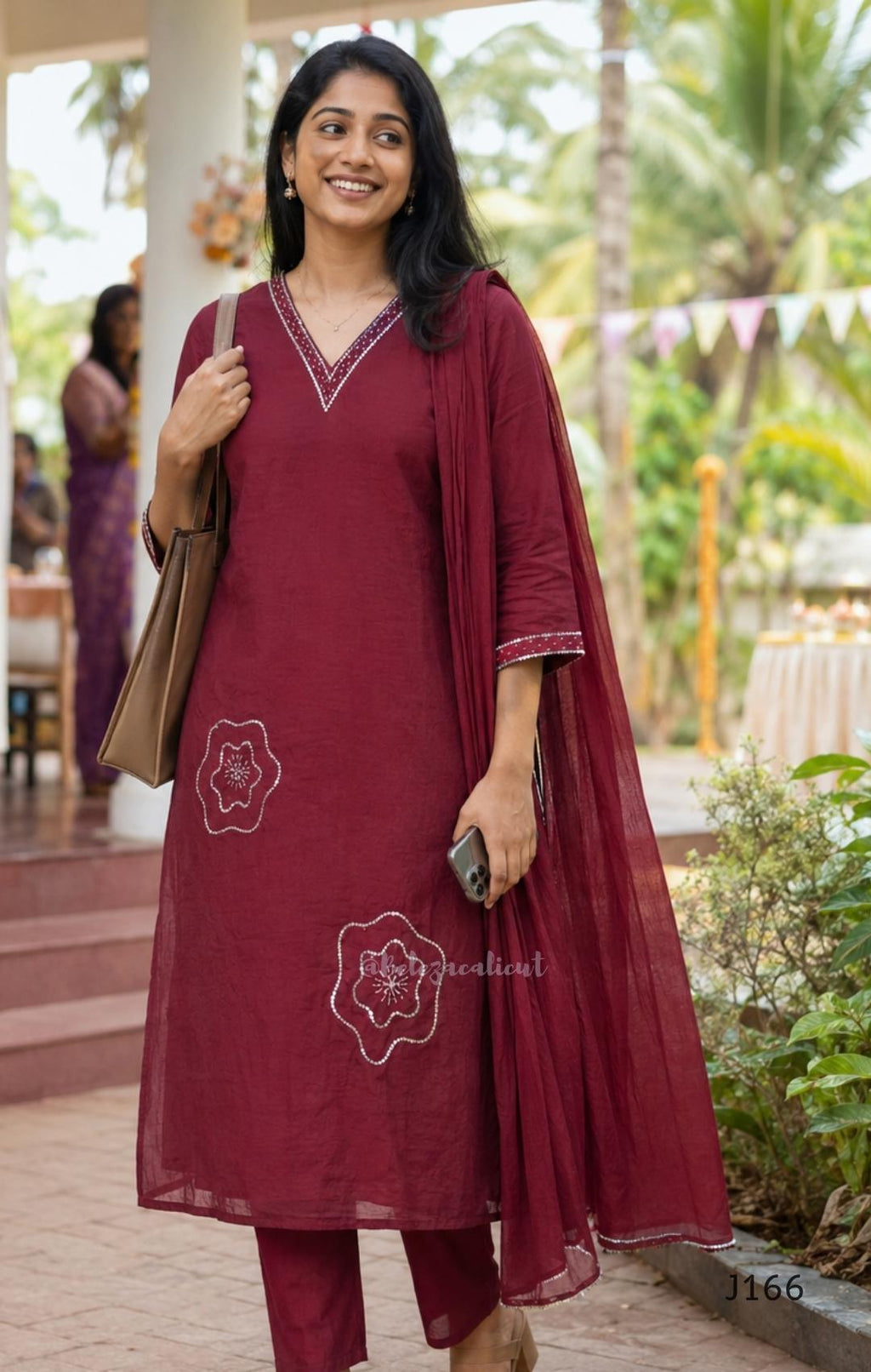 Maroon mul chanderi churidar set with silver sequin neckline, sleeve detailing, matching bottom and dupatta at Beleza Calicut.