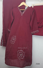 Maroon mul chanderi churidar set with silver sequin neckline, sleeve detailing, matching bottom and dupatta at Beleza Calicut.