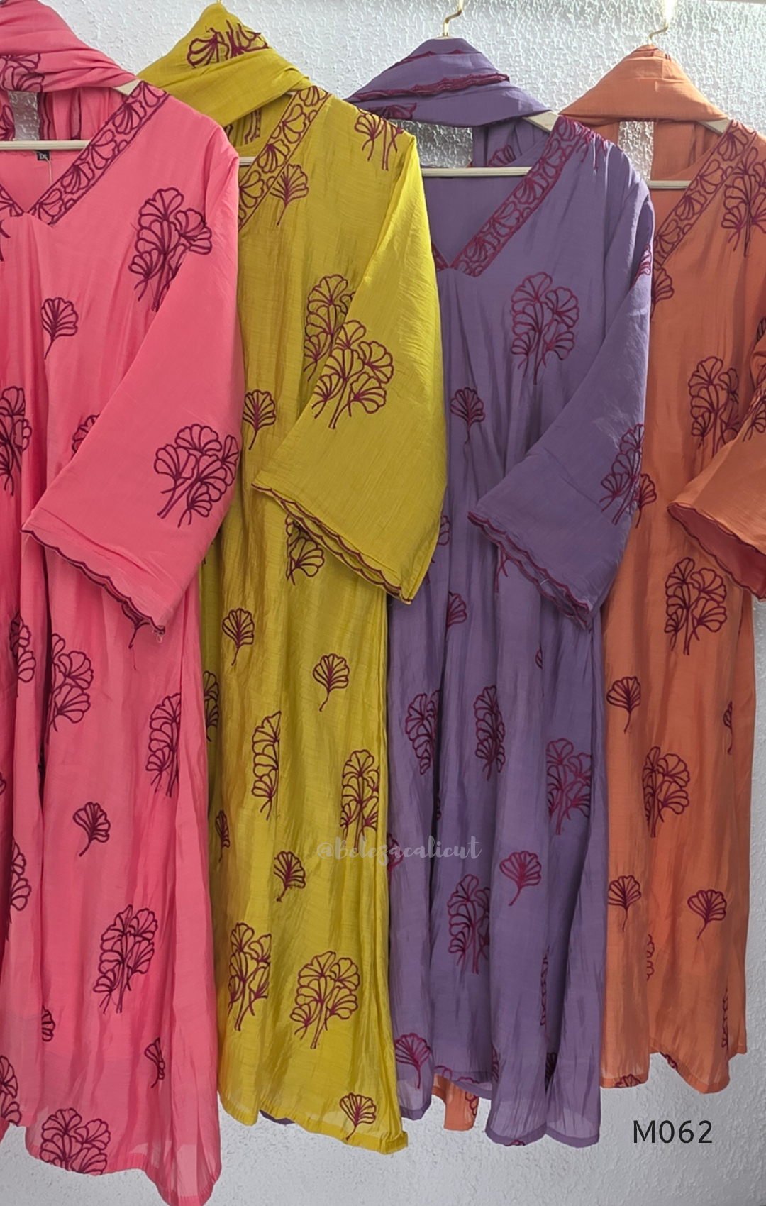 Mul chanderi A-line 3-piece churidar set in coral, lavender, mustard and rust orange with thread work.
