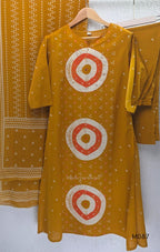 Mustard cotton 3-piece churidar set with abstract circle print kurta, matching printed dupatta and ankle-cuff bottom.