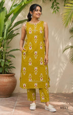 Mustard cotton top and bottom coord set with cream and rust motifs, tassel detailing and front mirror work.