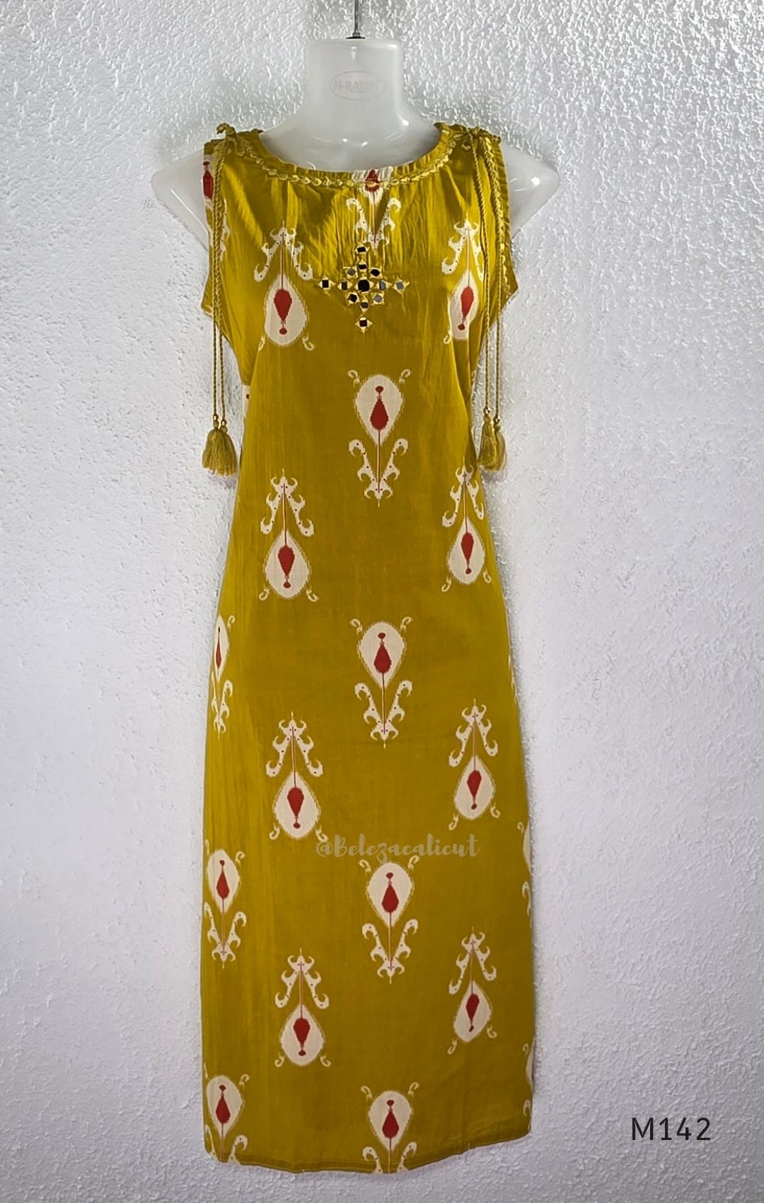 Mustard cotton top and bottom coord set with cream and rust motifs, tassel detailing and front mirror work.