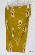 Mustard cotton top and bottom coord set with cream and rust motifs, tassel detailing and front mirror work.