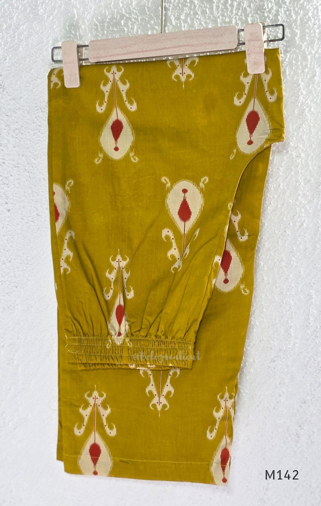 Mustard cotton top and bottom coord set with cream and rust motifs, tassel detailing and front mirror work.