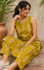 Mustard cotton top and bottom coord set with cream and rust motifs, tassel detailing and front mirror work.