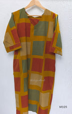 Warm mustard cotton long kurta with teal, deep pink and off-white striped rectangular motifs, V-neck and three-quarter sleeves.