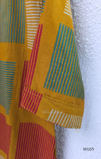 Warm mustard cotton long kurta with teal, deep pink and off-white striped rectangular motifs, V-neck and three-quarter sleeves.