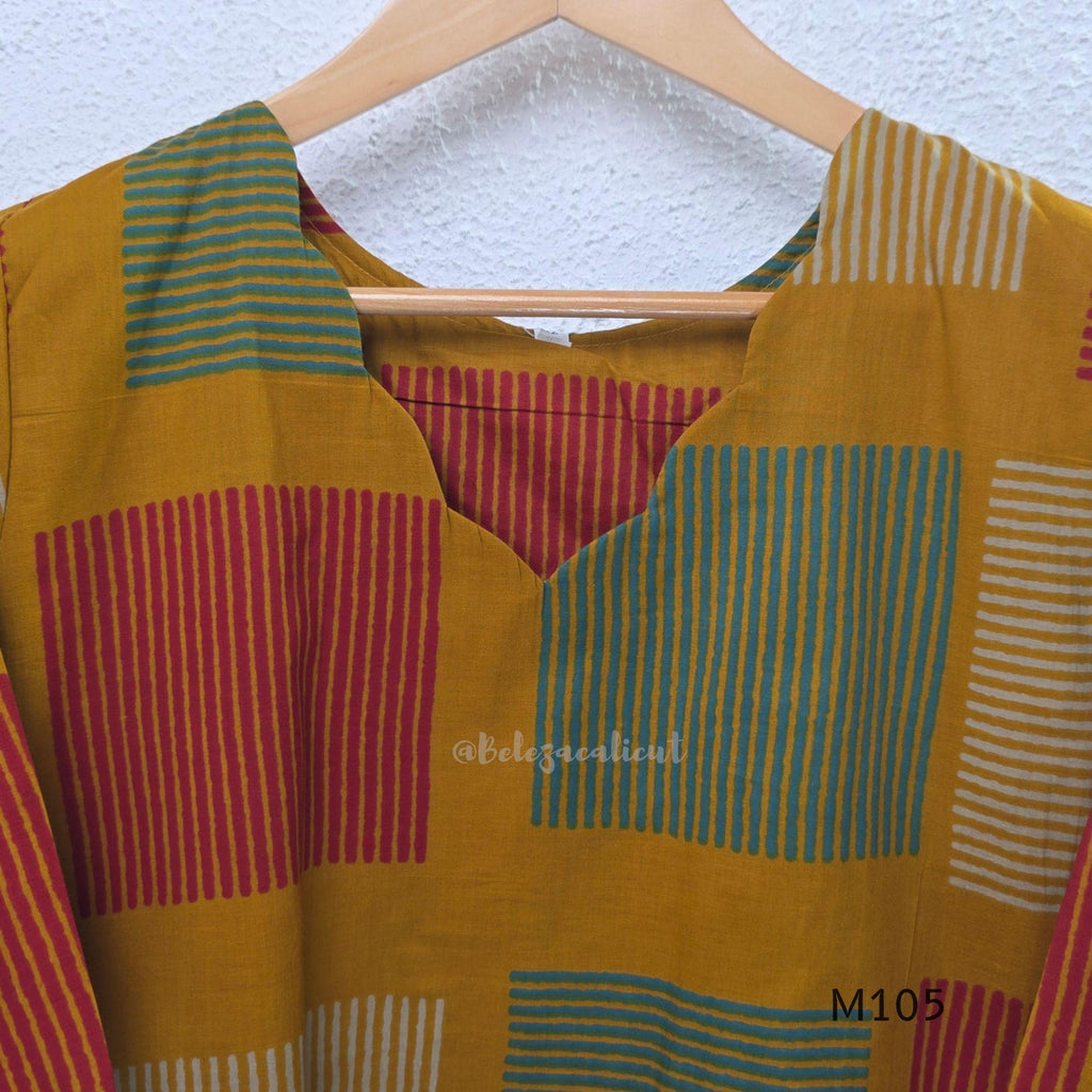 Warm mustard cotton long kurta with teal, deep pink and off-white striped rectangular motifs, V-neck and three-quarter sleeves.