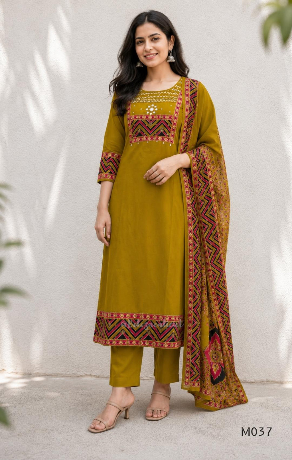 Mustard Jaipur cotton three-piece churidar set with mirror-detail yoke, printed borders and coordinated printed dupatta.