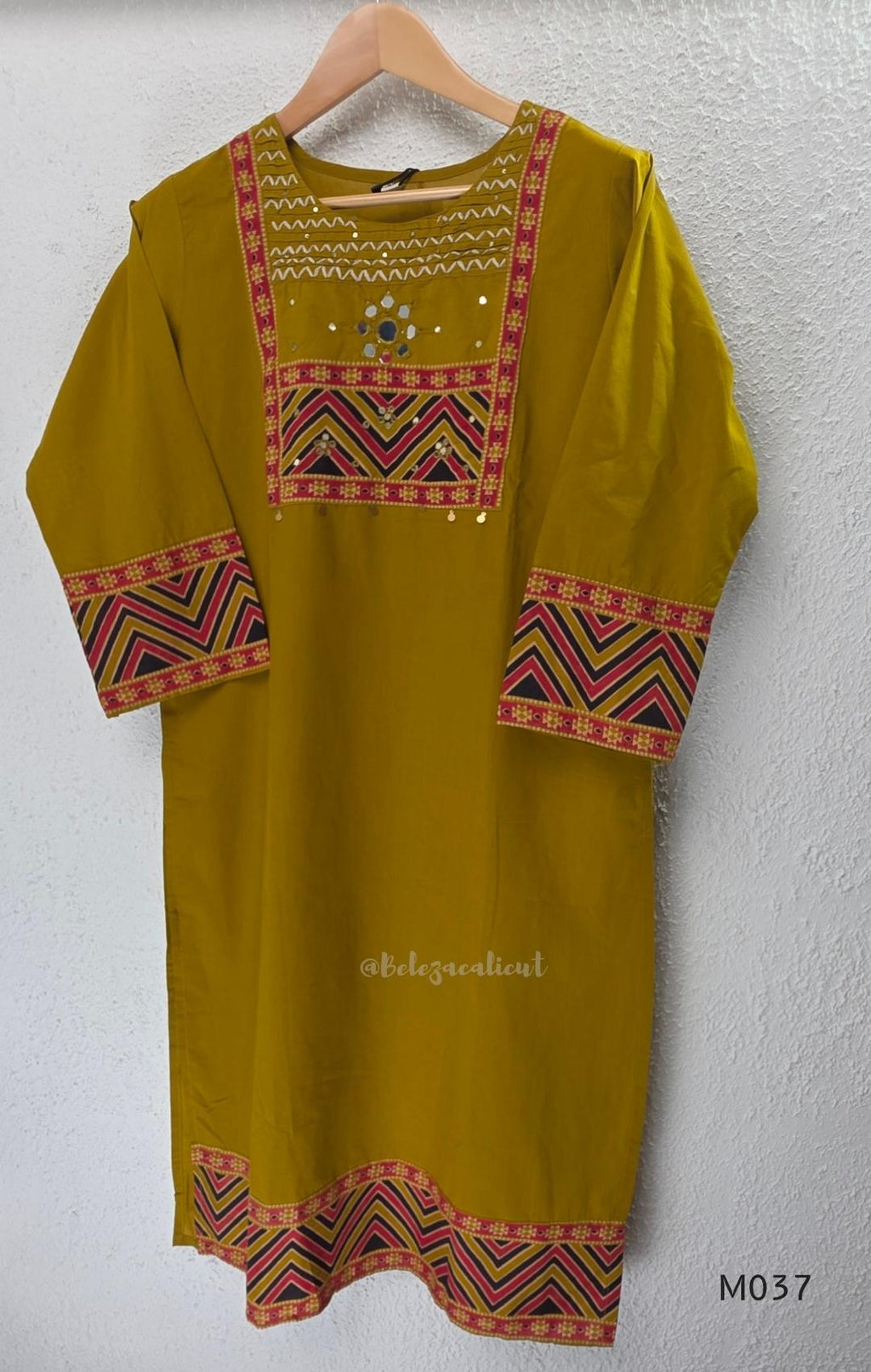 Mustard Jaipur cotton three-piece churidar set with mirror-detail yoke, printed borders and coordinated printed dupatta.