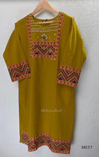 Mustard Jaipur cotton three-piece churidar set with mirror-detail yoke, printed borders and coordinated printed dupatta.