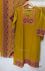 Mustard Jaipur cotton three-piece churidar set with mirror-detail yoke, printed borders and coordinated printed dupatta.