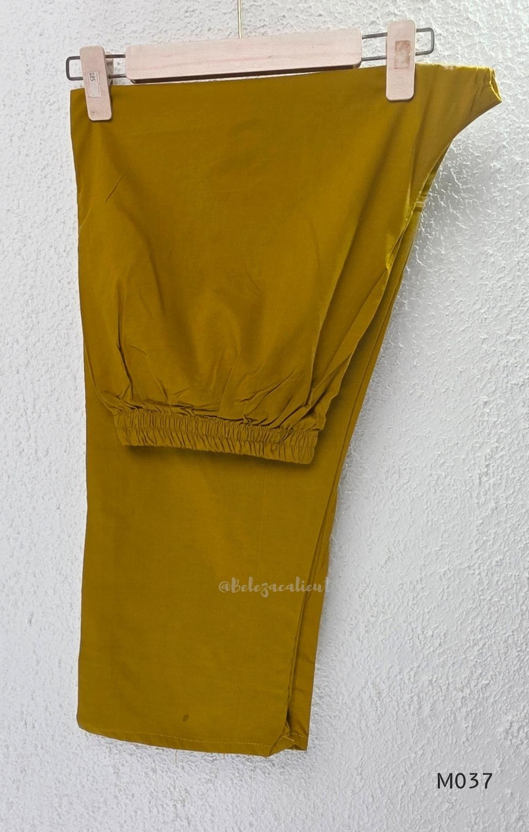 Mustard Jaipur cotton three-piece churidar set with mirror-detail yoke, printed borders and coordinated printed dupatta.