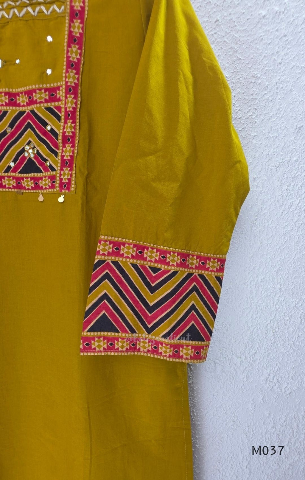 Mustard Jaipur cotton three-piece churidar set with mirror-detail yoke, printed borders and coordinated printed dupatta.