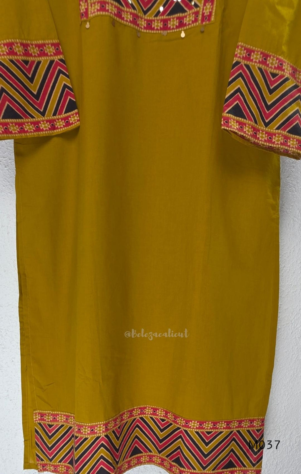 Mustard Jaipur cotton three-piece churidar set with mirror-detail yoke, printed borders and coordinated printed dupatta.