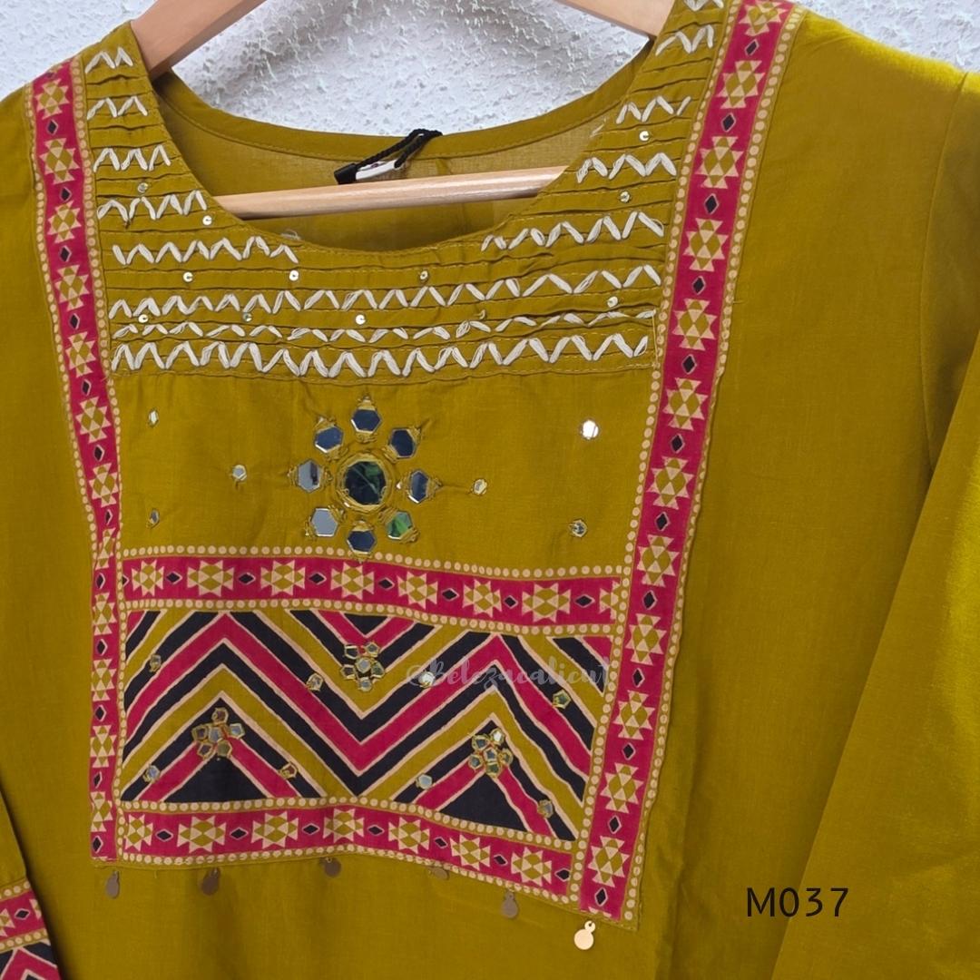 Mustard Jaipur cotton three-piece churidar set with mirror-detail yoke, printed borders and coordinated printed dupatta.
