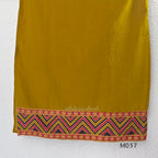 Mustard Jaipur cotton three-piece churidar set with mirror-detail yoke, printed borders and coordinated printed dupatta.