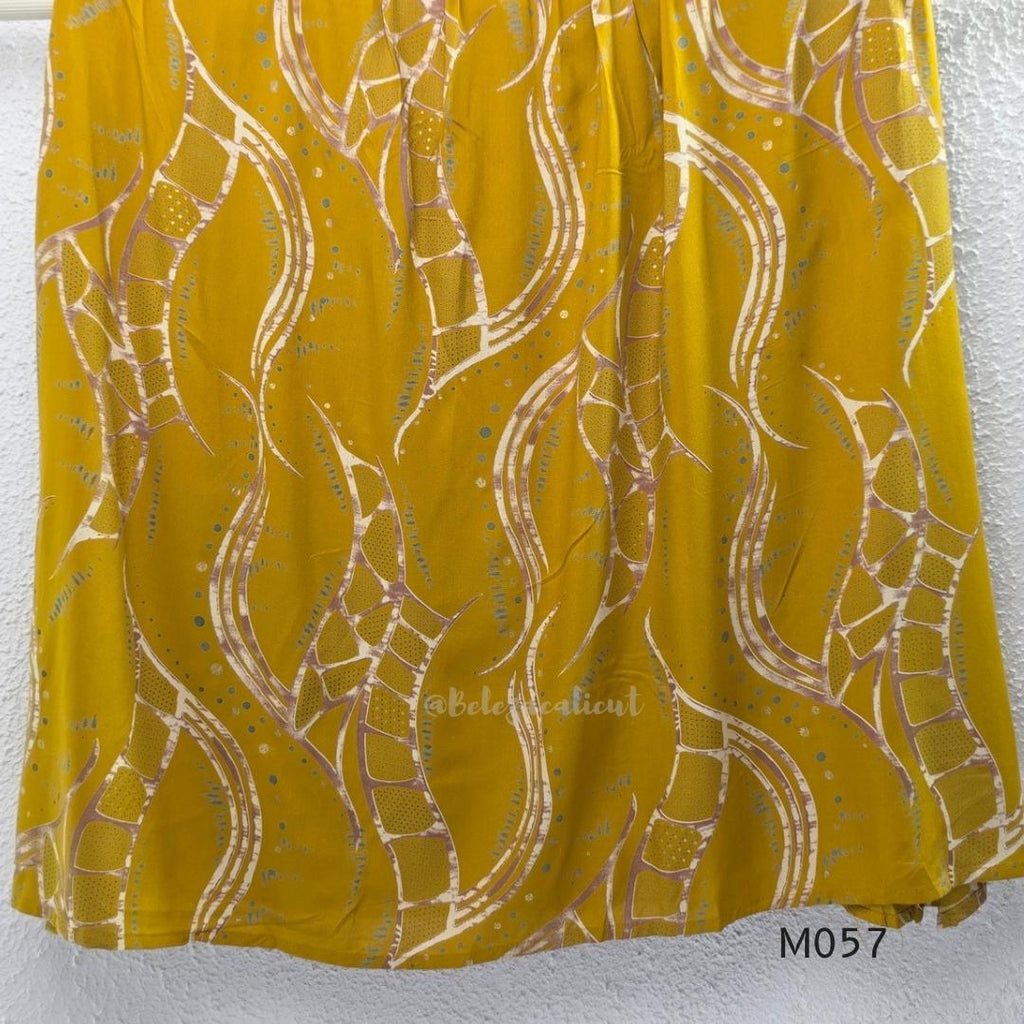 Warm mustard silk blend 2-piece set with abstract cream and taupe print, A-line mid-calf top and matching plain mustard pant.