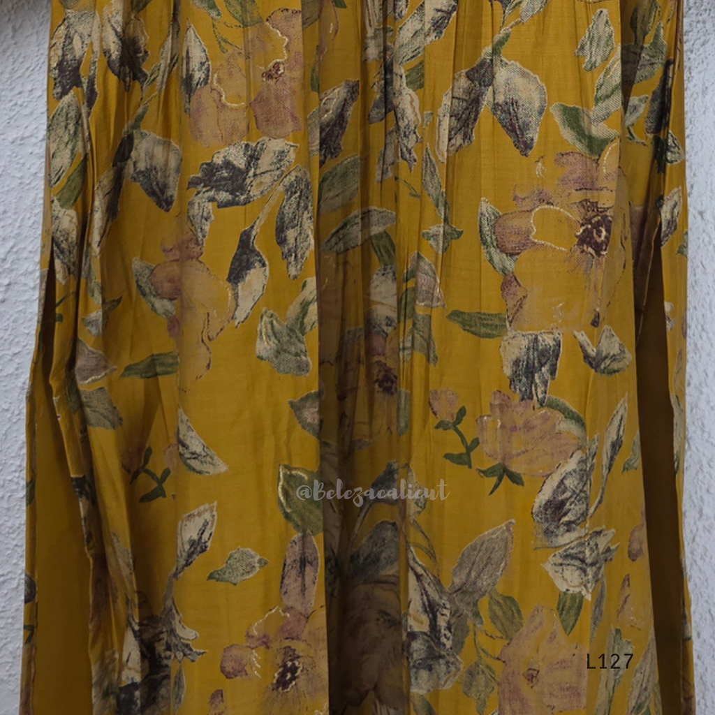Mustard yellow silk blend 2-piece kurti set with floral print, gathered yoke, 3/4 sleeves, button detail, and matching bottom.