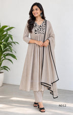 Muted ash-taupe Mul Chanderi churidar set with black leaf-pattern yoke, straight pants and matching bordered dupatta.