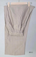 Muted ash-taupe Mul Chanderi churidar set with black leaf-pattern yoke, straight pants and matching bordered dupatta.