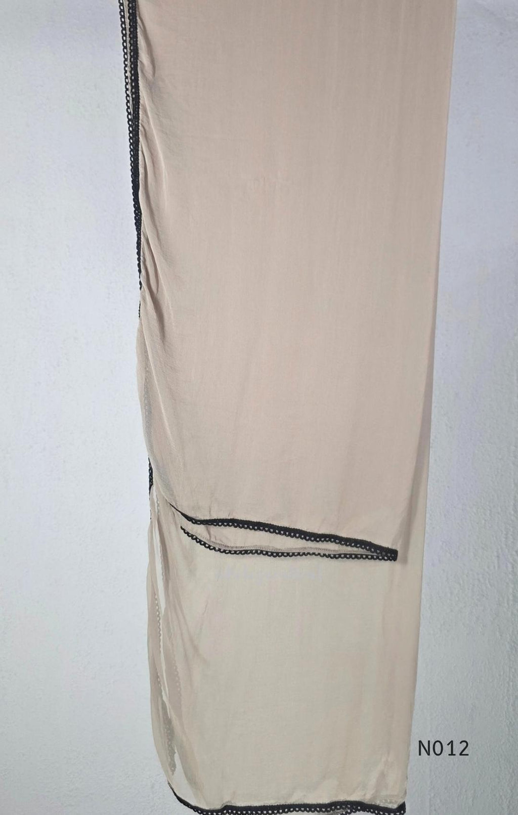 Muted ash-taupe Mul Chanderi churidar set with black leaf-pattern yoke, straight pants and matching bordered dupatta.