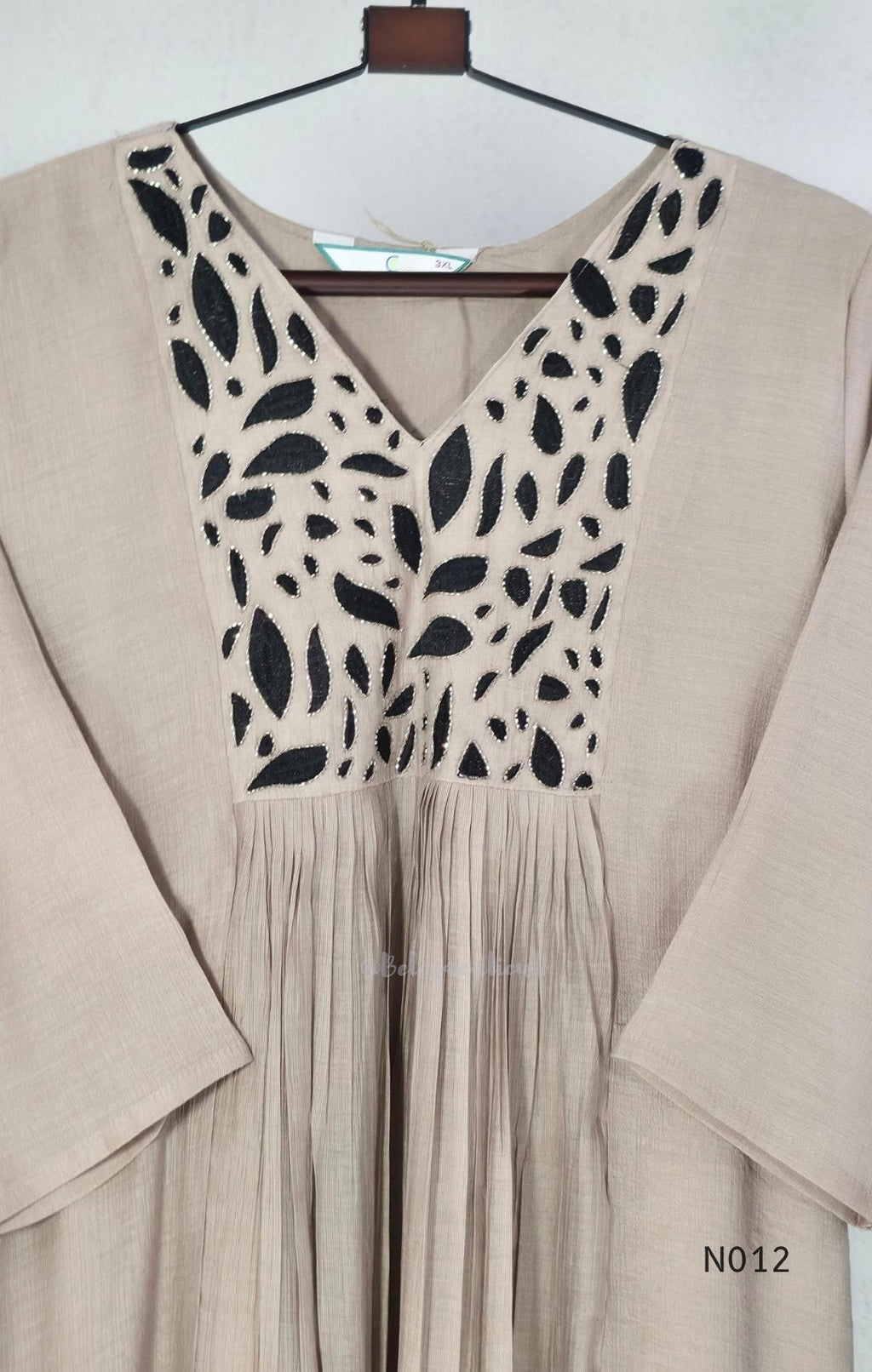 Muted ash-taupe Mul Chanderi churidar set with black leaf-pattern yoke, straight pants and matching bordered dupatta.