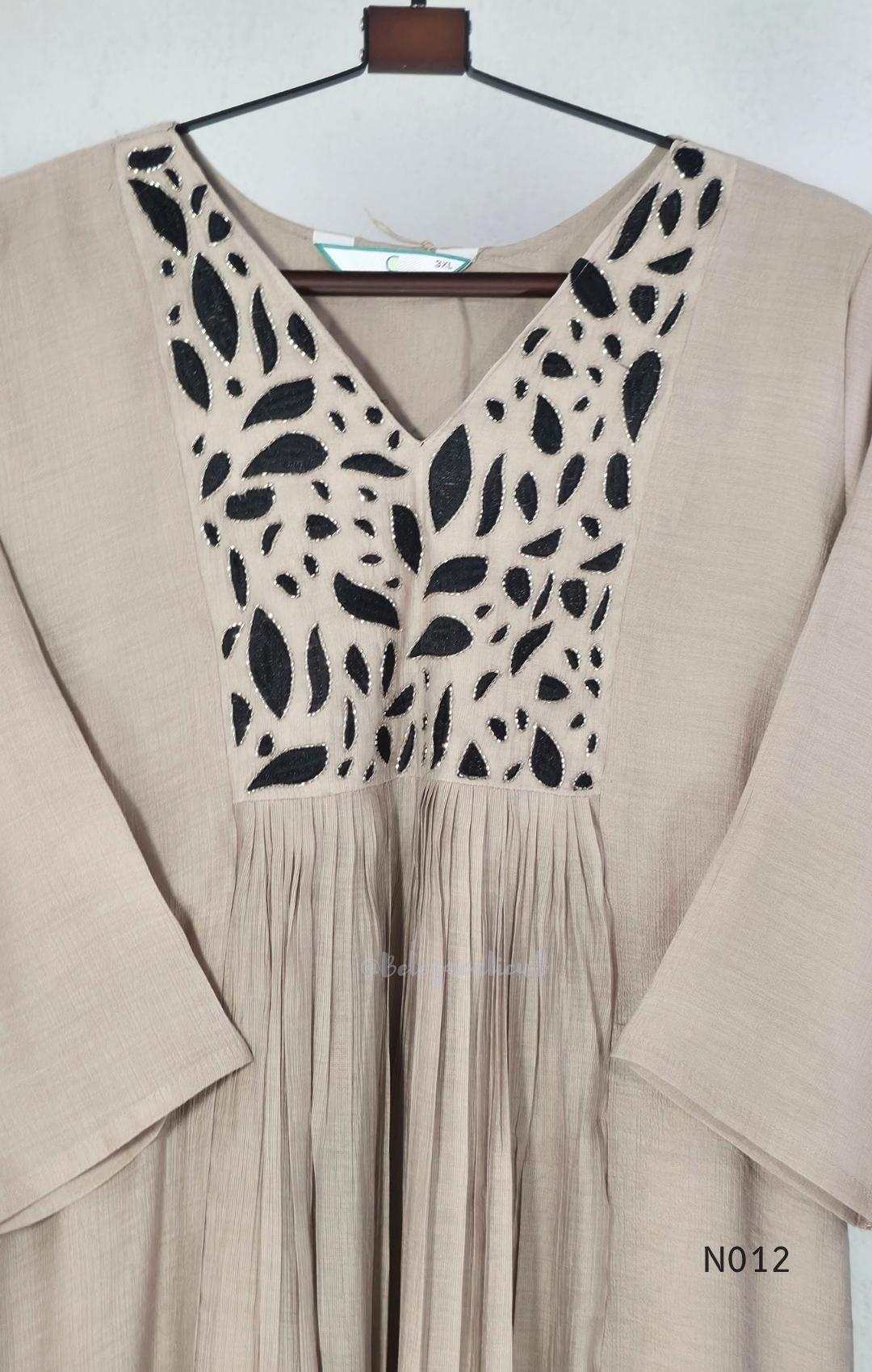 Muted ash-taupe Mul Chanderi churidar set with black leaf-pattern yoke, straight pants and matching bordered dupatta.