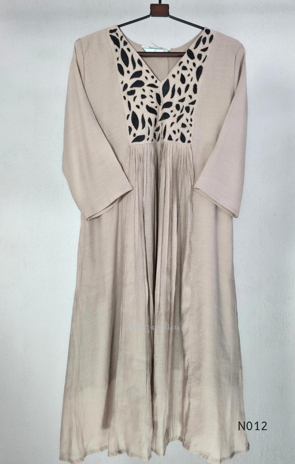 Muted ash-taupe Mul Chanderi churidar set with black leaf-pattern yoke, straight pants and matching bordered dupatta.