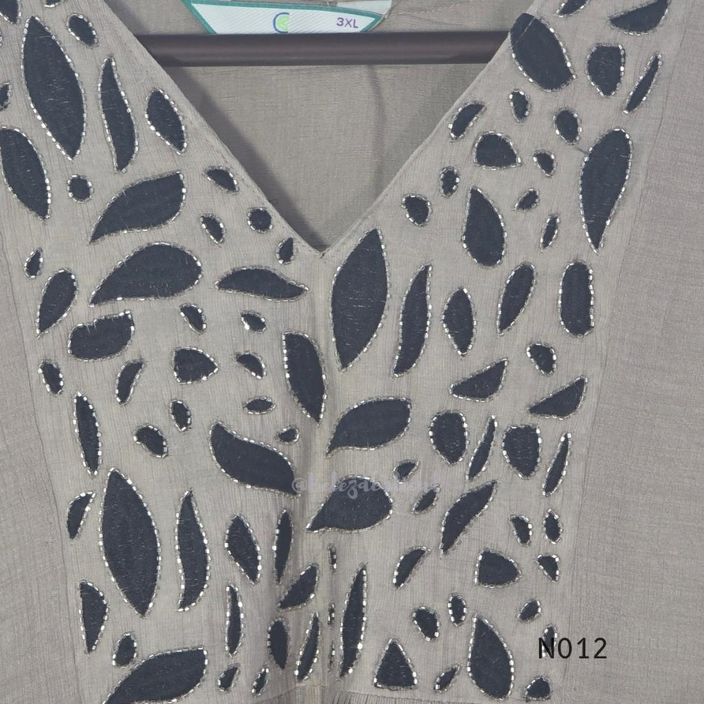 Muted ash-taupe Mul Chanderi churidar set with black leaf-pattern yoke, straight pants and matching bordered dupatta.
