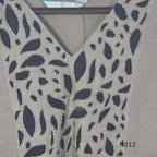 Muted ash-taupe Mul Chanderi churidar set with black leaf-pattern yoke, straight pants and matching bordered dupatta.