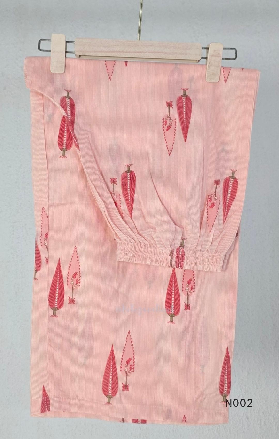 Soft peach cotton printed A-line button-front kurta with pink botanical motifs and matching wide-leg palazzo trousers. - view 5