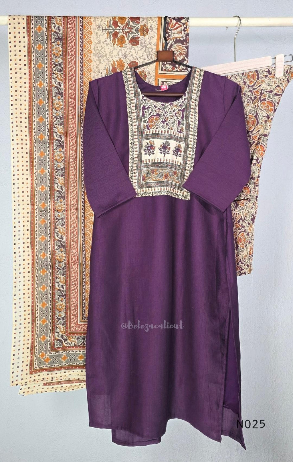 Grape-purple Chanderi silk-blend churidar set with a cream printed yoke, patterned cotton straight pants and a floral cotton dupatta.