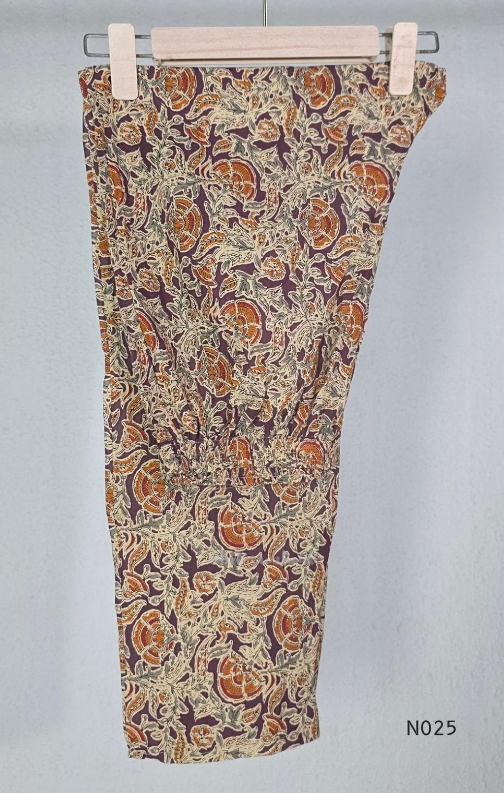 Grape-purple Chanderi silk-blend churidar set with a cream printed yoke, patterned cotton straight pants and a floral cotton dupatta.