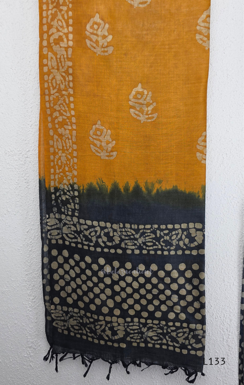 Navy blue chanderi silk churidar set with all-over cream polka dot block print, straight cut kurti with round neck and 3/4 sleeves, paired with plain mustard churidar bottom and mustard-navy dual-tone block print dupatta with tassel border, Indian ethnic wear from Beleza Calicut