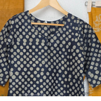 Navy blue chanderi silk churidar set with all-over cream polka dot block print, straight cut kurti with round neck and 3/4 sleeves, paired with plain mustard churidar bottom and mustard-navy dual-tone block print dupatta with tassel border, Indian ethnic wear from Beleza Calicut