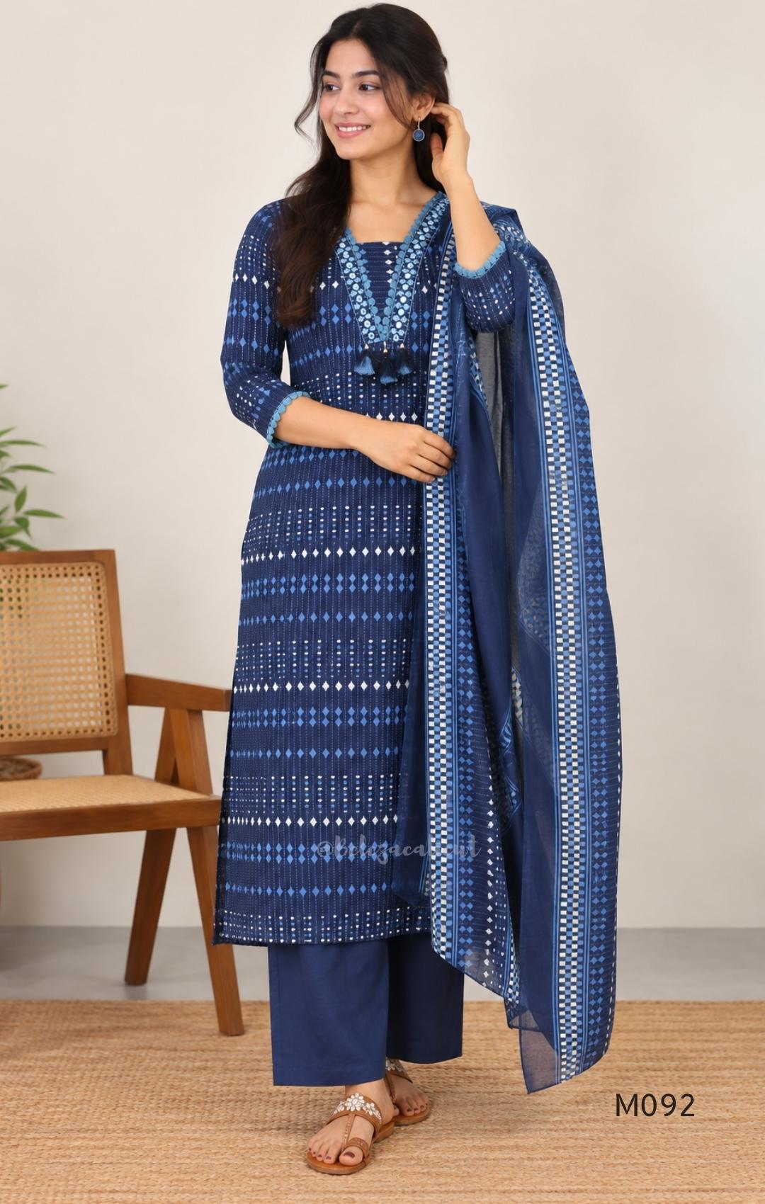 Deep navy blue cotton-blend churidar set with geometric print, embroidered V-neckline, plain wide straight bottom and printed dupatta.