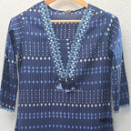 Deep navy blue cotton-blend churidar set with geometric print, embroidered V-neckline, plain wide straight bottom and printed dupatta.