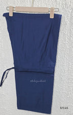 Navy blue Vertigan silk top and pant co-ord set with centre pleats and metallic gold circular side motifs.