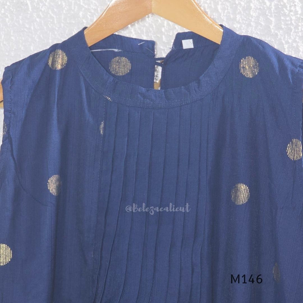 Navy blue Vertigan silk top and pant co-ord set with centre pleats and metallic gold circular side motifs.