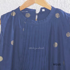 Navy blue Vertigan silk top and pant co-ord set with centre pleats and metallic gold circular side motifs.