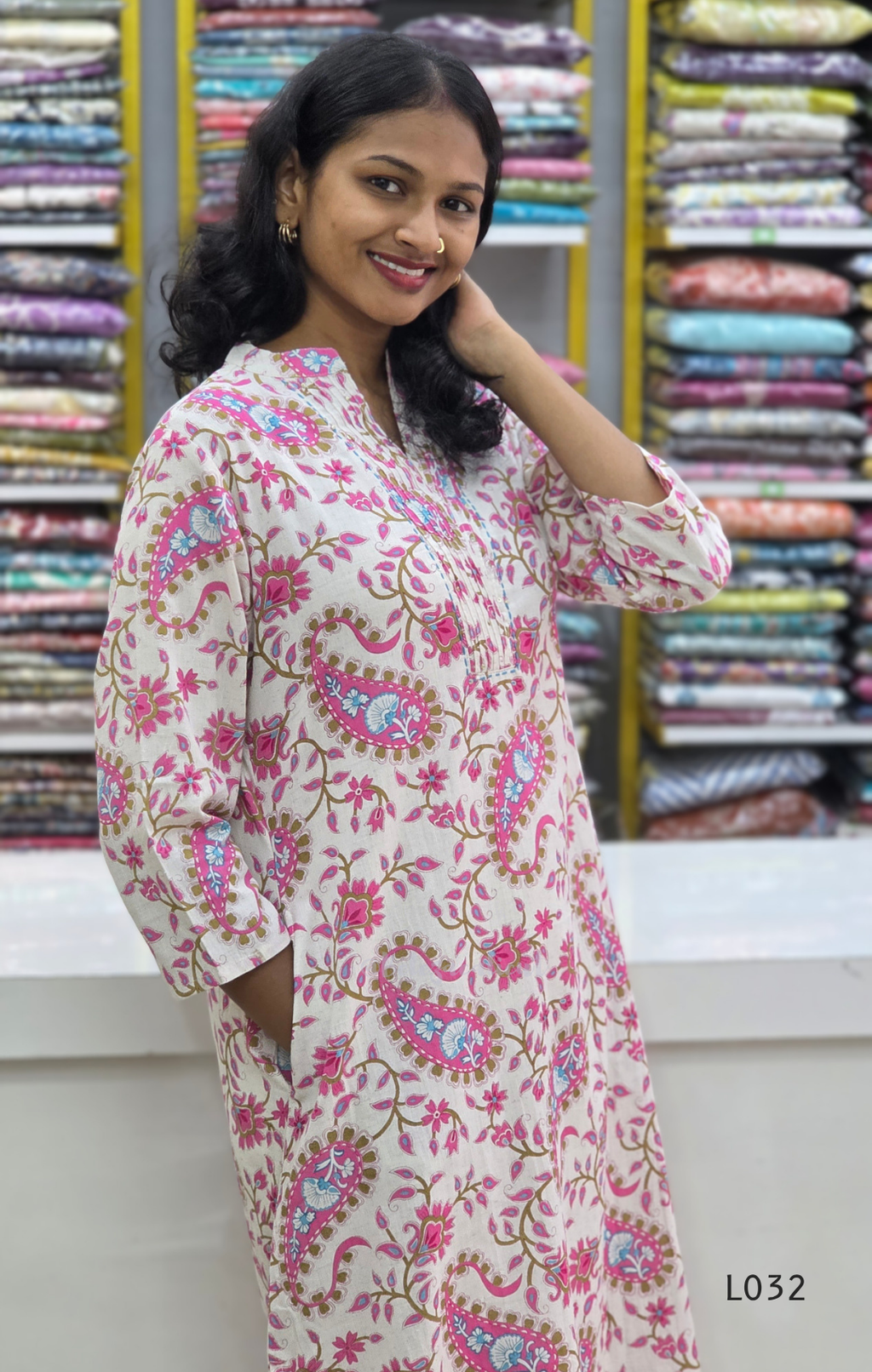 Off-white pure cotton kurti set with pink paisley floral print and matching cotton bottom, available at Beleza Calicut Kerala.