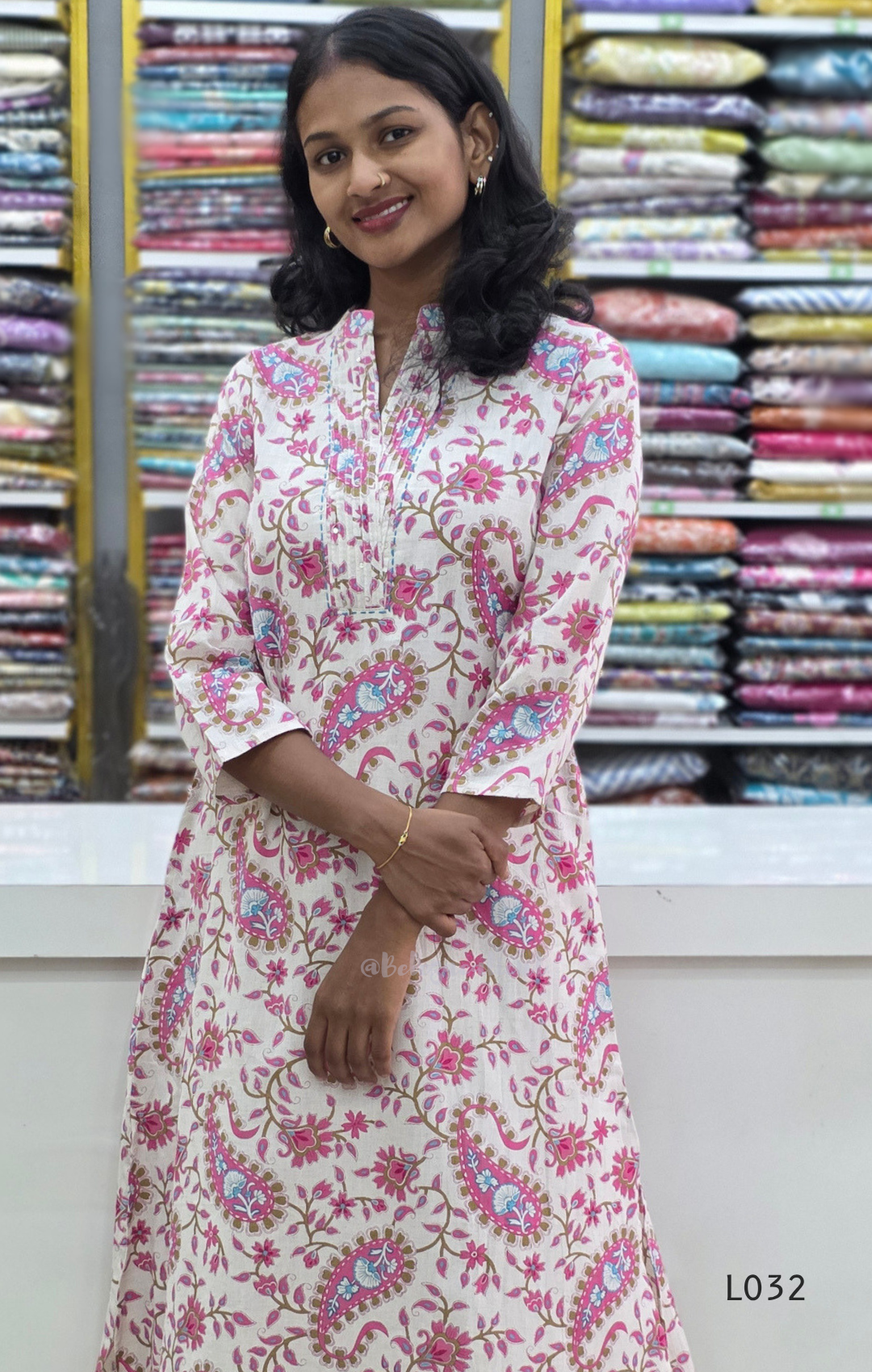 Off-white pure cotton kurti set with pink paisley floral print and matching cotton bottom, available at Beleza Calicut Kerala.