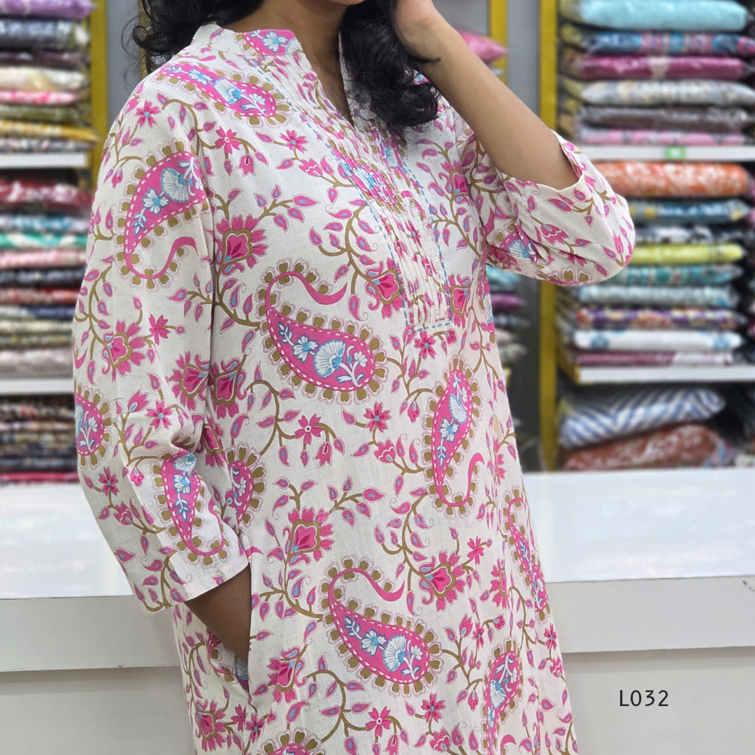 Off-white pure cotton kurti set with pink paisley floral print and matching cotton bottom, available at Beleza Calicut Kerala.