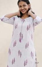Off white cotton 2-piece kurti set with lavender leaf print, striped bottom, 3/4 sleeves, and tassel neckline worn by model.