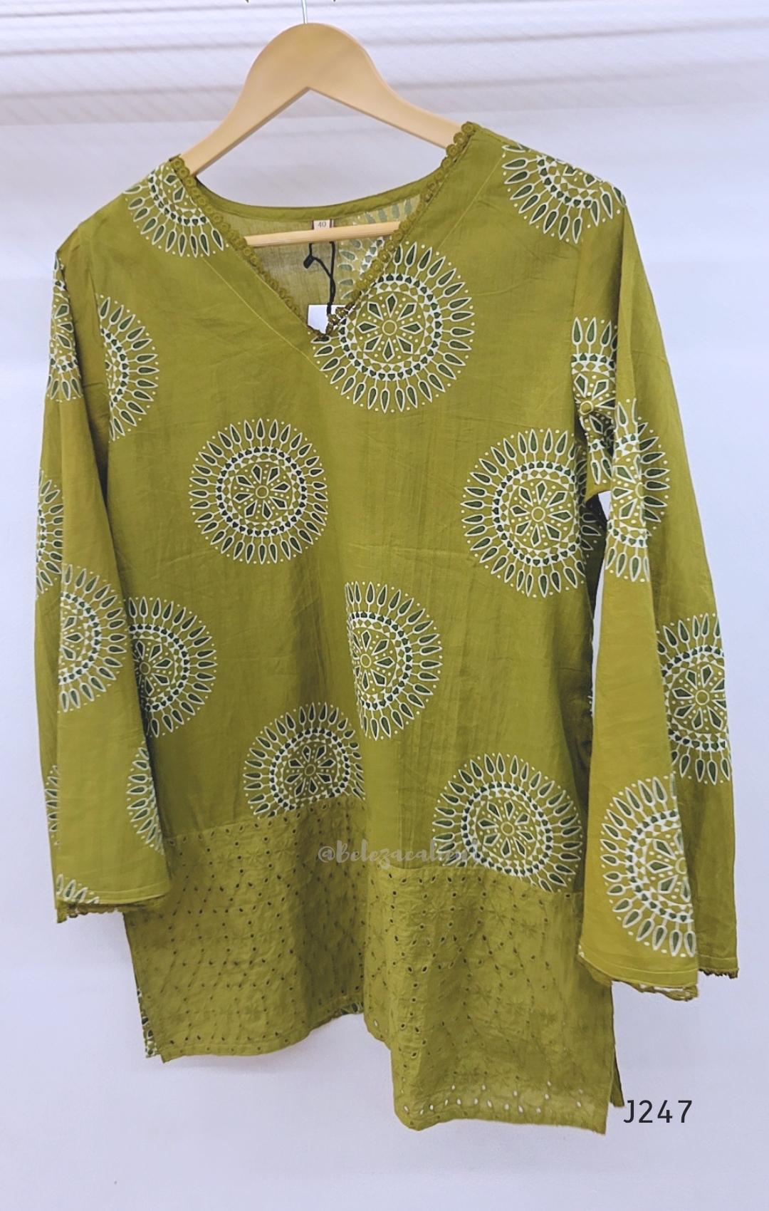 Olive green cotton short top with circular white and dark print and tonal cutwork-style lower panel.