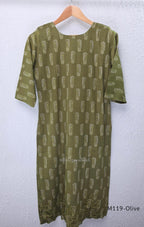 Olive green Cotton Silk churidar set with printed motifs, embroidered floral hem and cream-and-olive printed dupatta.