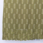 Olive green Cotton Silk churidar set with printed motifs, embroidered floral hem and cream-and-olive printed dupatta.