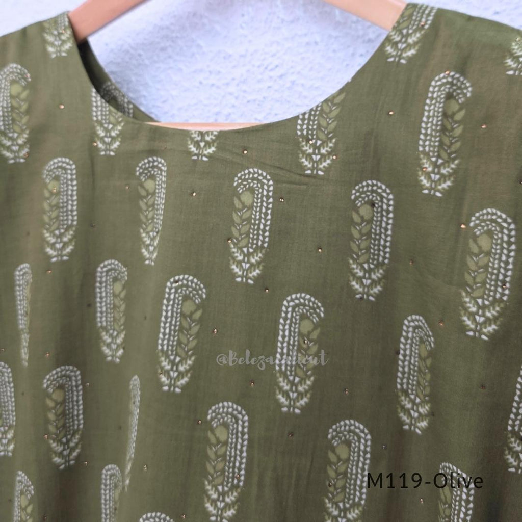 Olive green Cotton Silk churidar set with printed motifs, embroidered floral hem and cream-and-olive printed dupatta.