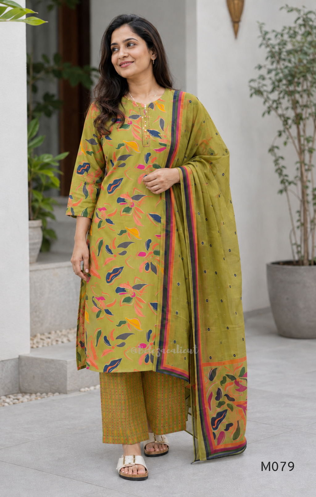 Olive green Jaipur cotton 3-piece churidar set with multicolour floral print, contrast dupatta, and printed straight bottom.
